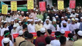 পবায় ভণ্ড পীর-ফকিরদের কার্যক্রম বন্ধের দাবিতে মানববন্ধন