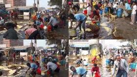 পাইপ ফেটে সড়কে ভাসছে তেল, বালতি-ড্রাম হাতে জনতার ভিড়